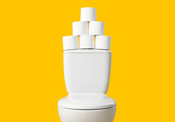 Toilet bowl with rolls of paper on color background