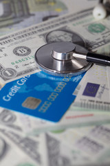 view of stethoscope on dollar banknotes, health insurance concept