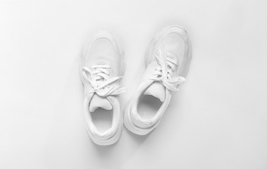 Pair of sport shoes on white background - obrazy, fototapety, plakaty
