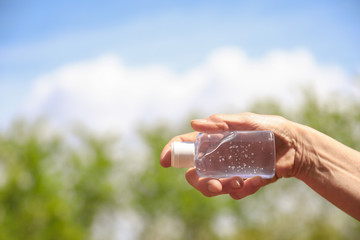 Coronavirus prevention - hand sanitizer gel, isolated on natural background