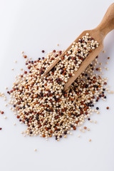 mix of quinoa grains on white acrylic background