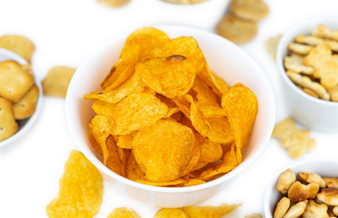 Mixed Snacks isolated on white (close up shot; selective focus)
