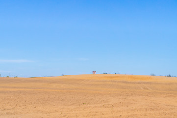 Fototapeta na wymiar Sandy landscape in the Arabian desert and blue sky