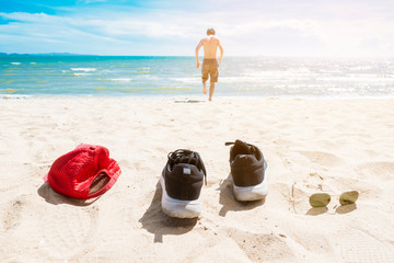 Freedom man is running to the sea, vacation summer concept