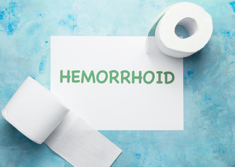 Toilet paper on color background. Hemorrhoids concept