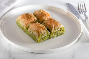 Traditional, delicious Turkish baklava on white plate