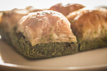 Traditional, delicious Turkish baklava on white plate
