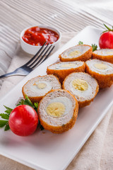 Scotch egg meat balls on rustic wooden background