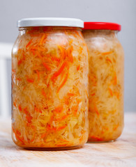 Glass jars with homemade sauerkraut. Winter food