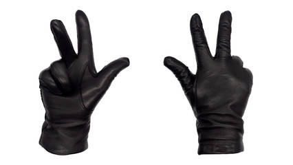 Obraz premium Hands wearing black leather gloves with thumb, index, and middle fingers raised, view from front and back. Female hand isolated, no skin
