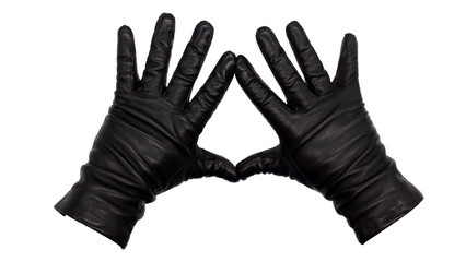 Hands wearing black leather gloves making a diamond or kite frame between thumb and index finger with fingers splayed, palms down.  Female hand isolated, no skin