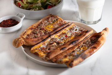 Traditional Turkish pide with meat and egg