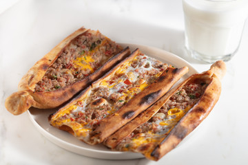 Traditional Turkish pide with meat and egg
