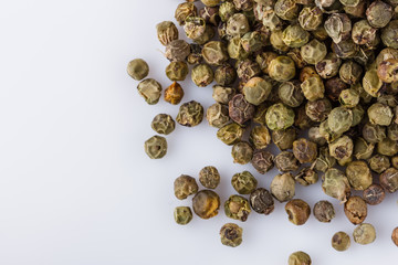 spicy green peppers on white acrylic background