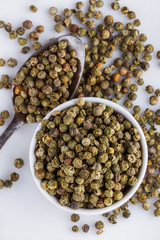 green peppers in bowl on white background
