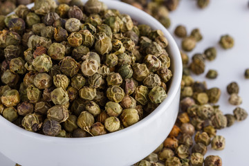 green peppers in bowl on white background