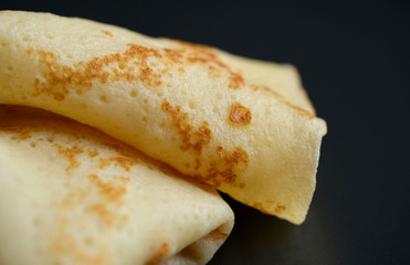 Cheesy, beautiful, delicate pancake closeup. Soft focus and gentle bokeh.