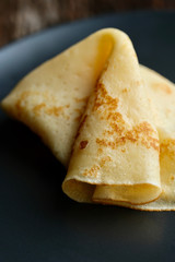 Cheesy, beautiful, delicate pancake closeup. Soft focus and gentle bokeh.