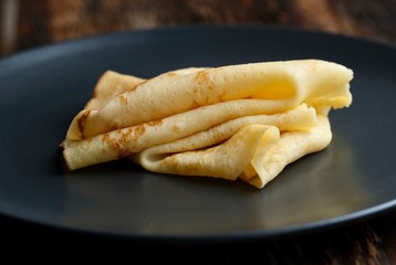 Cheesy, beautiful, delicate pancake closeup. Soft focus and gentle bokeh.