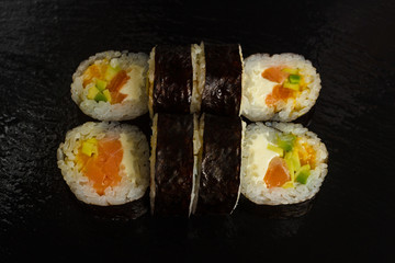 Japanese food: Set of salmon sushi and rolls with salmon and eel
