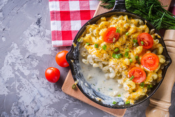delicious pasta and cheese casserole in a cast iron skillet