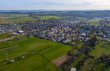Fototapeta na wymiar Aerial view of the village Wimsheim in Germany on a sunny morning in early spring 