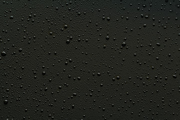 Water droplets on black background.