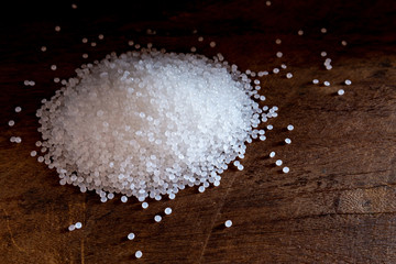 Close-up of plastic polymer granules. hand hold Polymer pellets. polymer plastic. compound polymer.