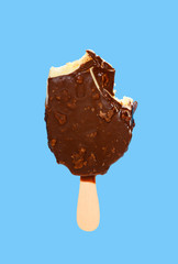 chocolate outer popsicle with some bite on blue background