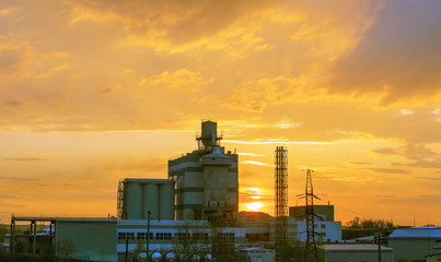 Heavy industry factory building on sunset background