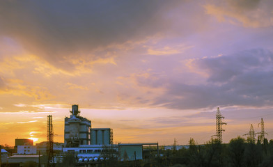 Heavy industry factory building on sunset background