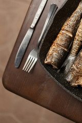Grilled spicy fish on desk. Roasty fish concept.