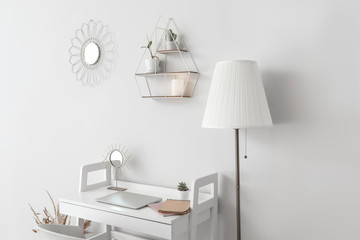 Fototapeta premium Stylish workplace near white wall in room
