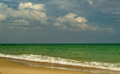 Fototapeta na wymiar Sea view from tropical beach with sunny sky.