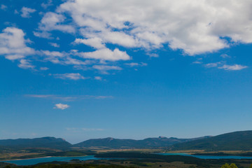 landscape of beautiful forest nature with fields and blue sky
