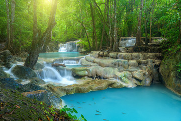 Beautiful waterfall in deep forest at Erawan National Park, Thailand. - obrazy, fototapety, plakaty
