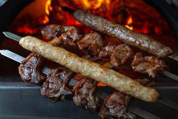 kebabs on a background of a flame in the oven