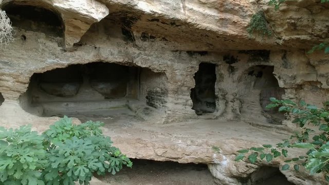 Samandag, Hatay / Turkey : October 30 / 2019 : Besikli magara (meaning cave with cradles) which is tombs of the kings near to titus vespasianus tunnel at samandag, hatay