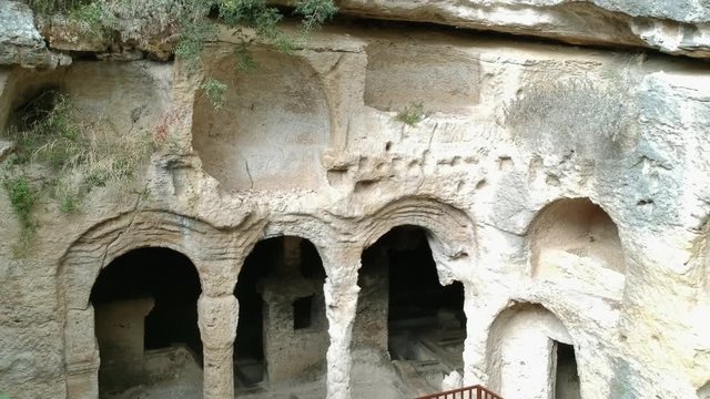 Samandag, Hatay / Turkey : October 30 / 2019 : Besikli magara (meaning cave with cradles) which is tombs of the kings near to titus vespasianus tunnel at samandag, hatay