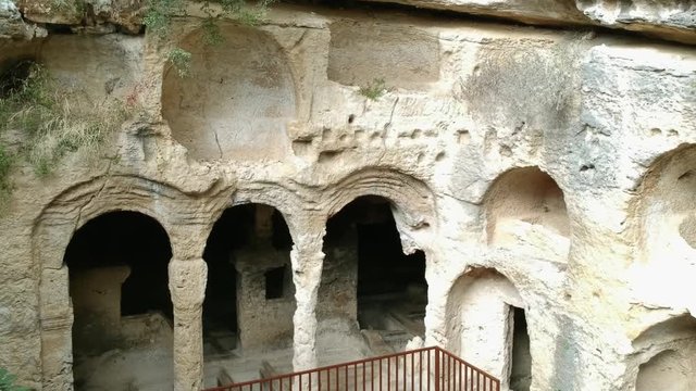 Samandag, Hatay / Turkey : October 30 / 2019 : Besikli magara (meaning cave with cradles) which is tombs of the kings near to titus vespasianus tunnel at samandag, hatay