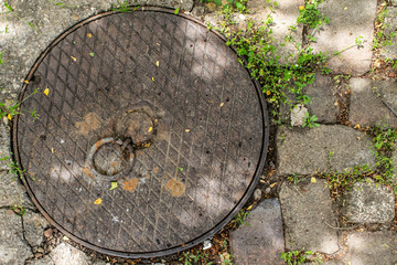 rusty manhole cover