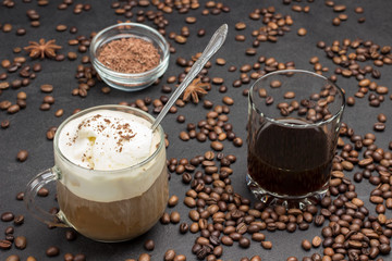 Glasse coffee, drink mix of cold coffee and ice cream. Glass with coffee. Coffee beans scattered on table.