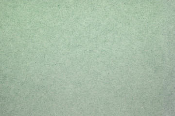 A dense industrial sheet of grey paper with a textured surface