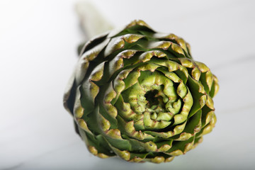 Obraz premium Close-up of fresh artichoke on white background