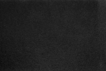 A dense industrial sheet of grey paper with a textured surface
