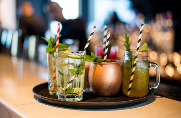 Tray with bright cocktails in a restaurant