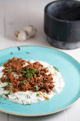 Turkish and Arabic Traditional Ramadan Kebab Ali Nazik on white rustic wood background.