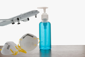Alcohol gels and mask filter are  protection from virus, plane passenger concepts before by travel