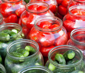 Fototapeta na wymiar Pickling (canning) tomatoes and cucumbers.