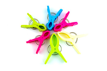 Colorfull plasstic clothespins on the white background